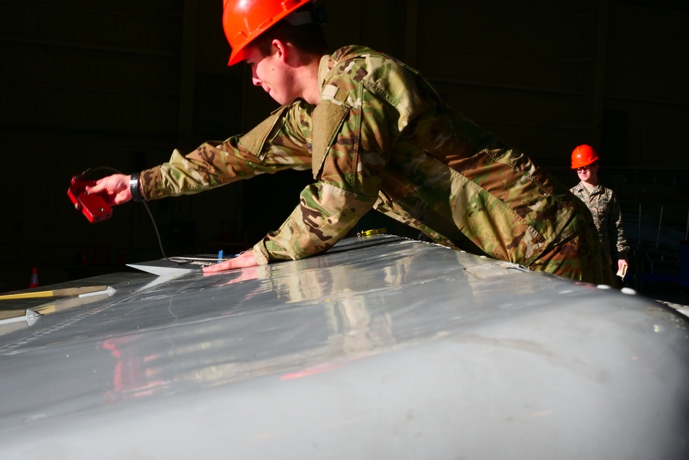 Team JSTARS conducts maintenance on a E-8C Joint STARS aircraft at Robins AFB
