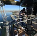 Coast Guard electronics technicians repair critical equipment aboard National Security Cutter while 147’ feet above sea level