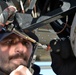 Coast Guard electronics technicians repair critical equipment aboard National Security Cutter while 147’ feet above sea level