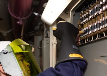 U.S. Sailor replaces a fuse