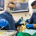 U.S. Sailors conduct dental procedure