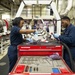 U.S. Sailors clean tools