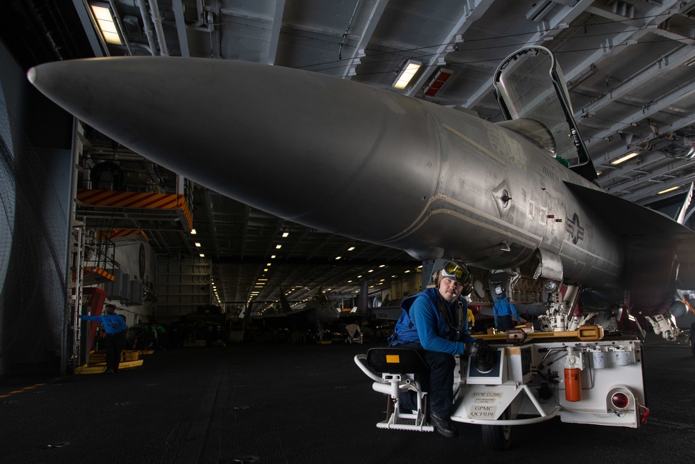 U.S. Sailor taxies an F/A-18E Super Hornet