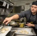 U.S. Sailor prepares food