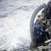 U.S. Sailors observe a probe assembly from the fleet replenishment oiler USNS Guadalupe