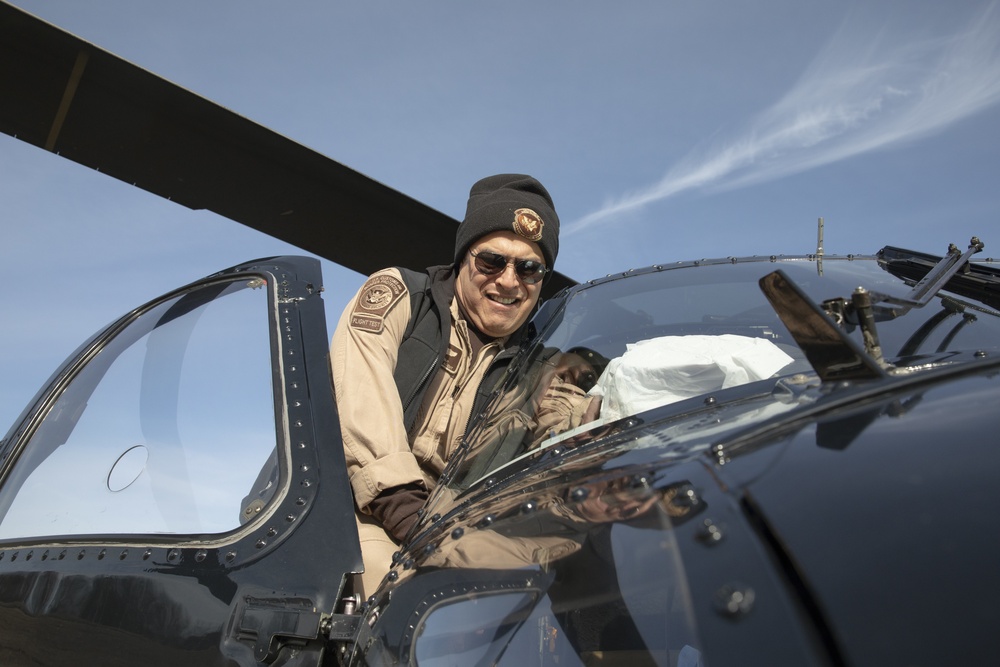 AMO Air Interdiction Agent cleans windshield of UH-60 Black Hawk