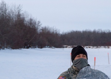 Guardsmen engage with western Alaskans during sled dog race