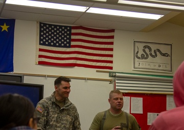 Guardsmen engage with western Alaskans during sled dog race