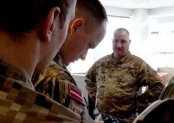 Latvian delegation is introduced to night-vision capabilities of the Michigan National Guard
