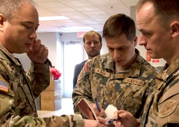 Latvian delegation reviews Michigan National Guard capabilities at the Army Aviation Support Facility in Grand Ledge, Michigan