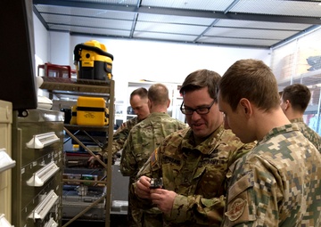 Latvian delegation tours the helicopter maintenance systems at the Army Aviation Support Facility in Grand Ledge, Michigan