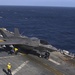 F-35B Lightning II fighters conduct flight operations at sea with external pylons