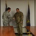 Lt. Col. John shakes Col. Christopher Hesse's hand during promotion ceremony