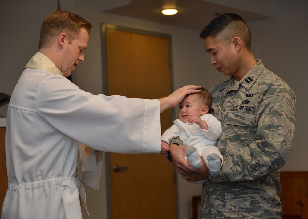 1st Lt. Michael Zimmer, chaplain performs the laying on of hands during the baptism ceremony
