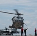 An MH-60S Sea Hawk lands on the flight deck