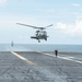 An MH-60R Sea Hawk prepares to land on the flight deck