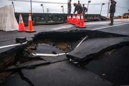 Building Bridges: U.S. Marines and contractors assess the safety and durability of a medium girder bridge