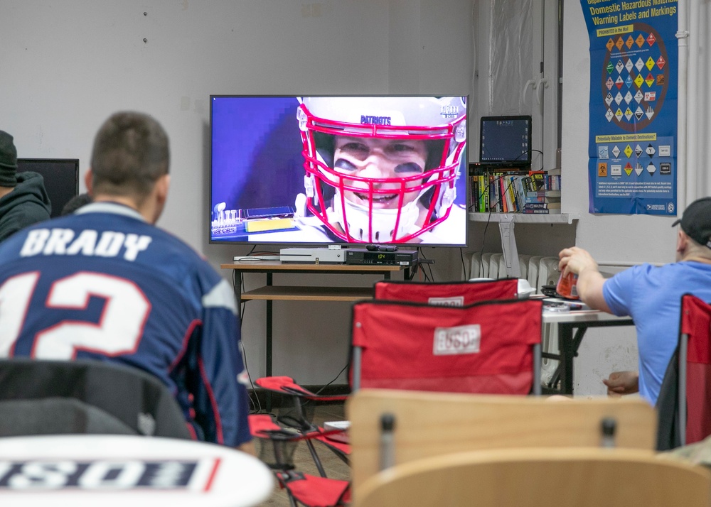 U.S. service members cheer for their team in Super Bowl LII