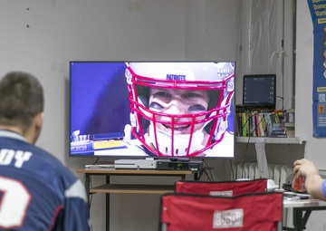U.S. service members cheer for their team in Super Bowl LII