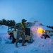 Soldier digs vehicle out of snow