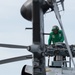 U.S. Sailor conducts preflight checks on an MH-60R Sea Hawk