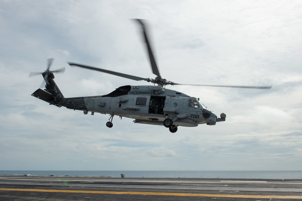 An MH-60R Sea Hawk takes off from the flight deck