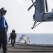 Cpl. Joseph Isajiw inspects the landing gear of a CH-53E Super Stallion