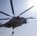 A Marine fast-ropes from a CH-53E Super Stallion