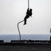 A Marine fast-ropes from a CH-53E Super Stallion
