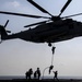 Marines fast-rope from a CH-53E Super Stallion