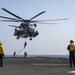 Marines fast-rope from a CH-53E Super Stallion