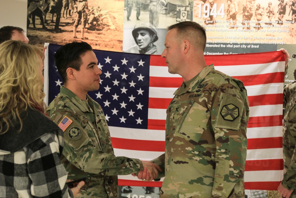 Reenlistment unites two generations of Army