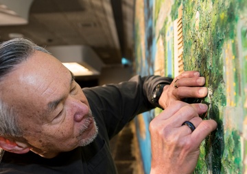 Cold War-era wall mural comes down