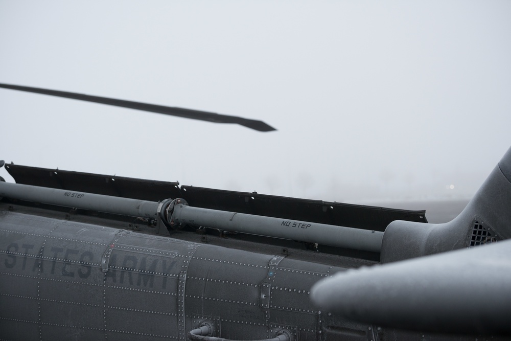 40-hour maintenance on 1CAB 1ID UH-60 Black Hawk in cold weather