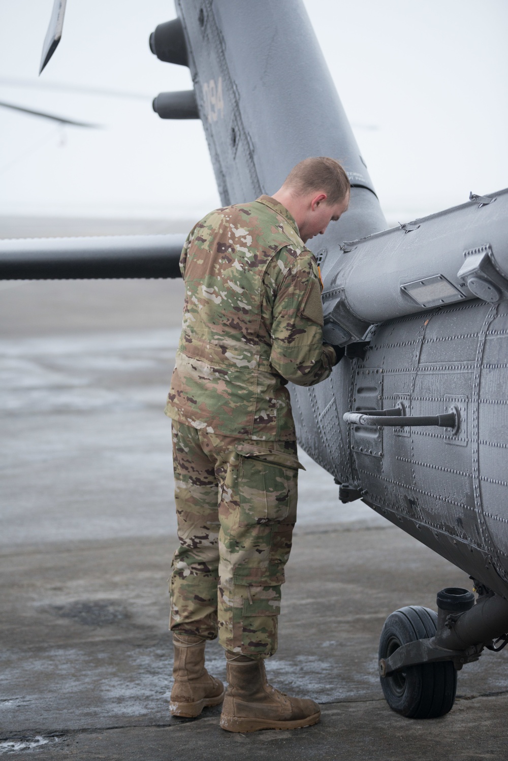 40-hour maintenance on 1CAB 1ID UH-60 Black Hawk in cold weather