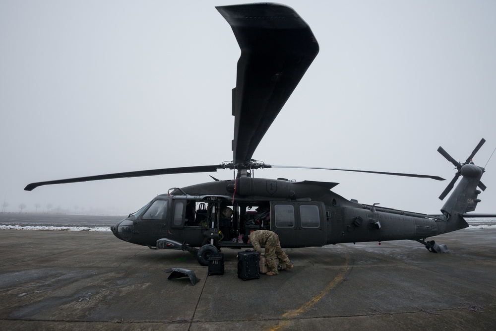 40-hour maintenance on 1CAB 1ID UH-60 Black Hawk in cold weather