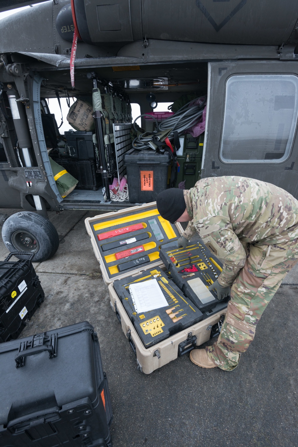 40-hour maintenance on 1CAB 1ID UH-60 Black Hawk in cold weather