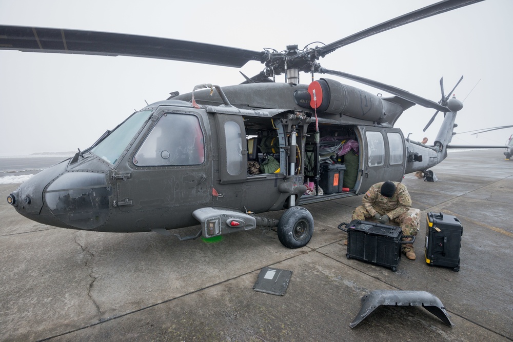 40-hour maintenance on 1CAB 1ID UH-60 Black Hawk in cold weather