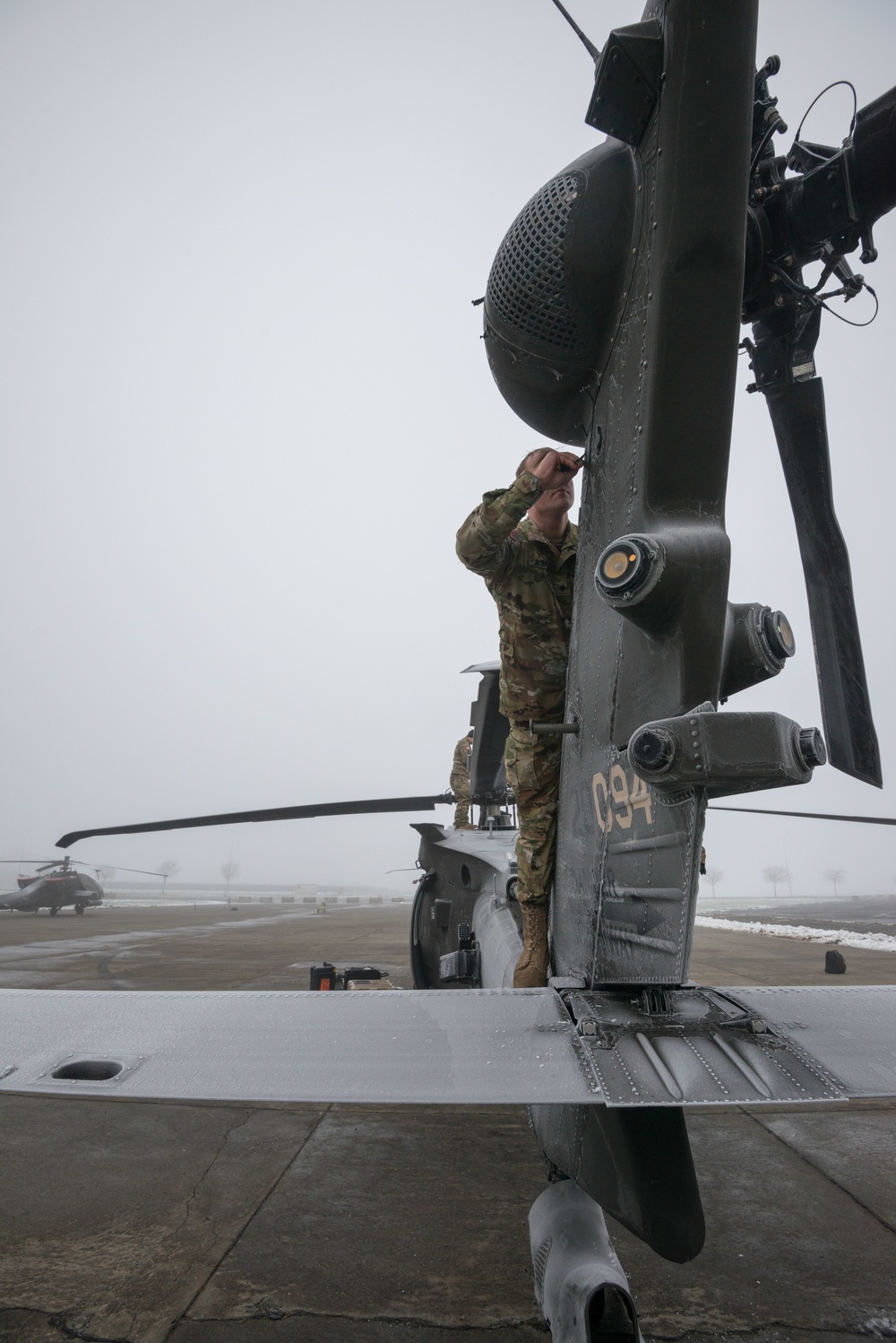 40-hour maintenance on 1CAB 1ID UH-60 Black Hawk in cold weather