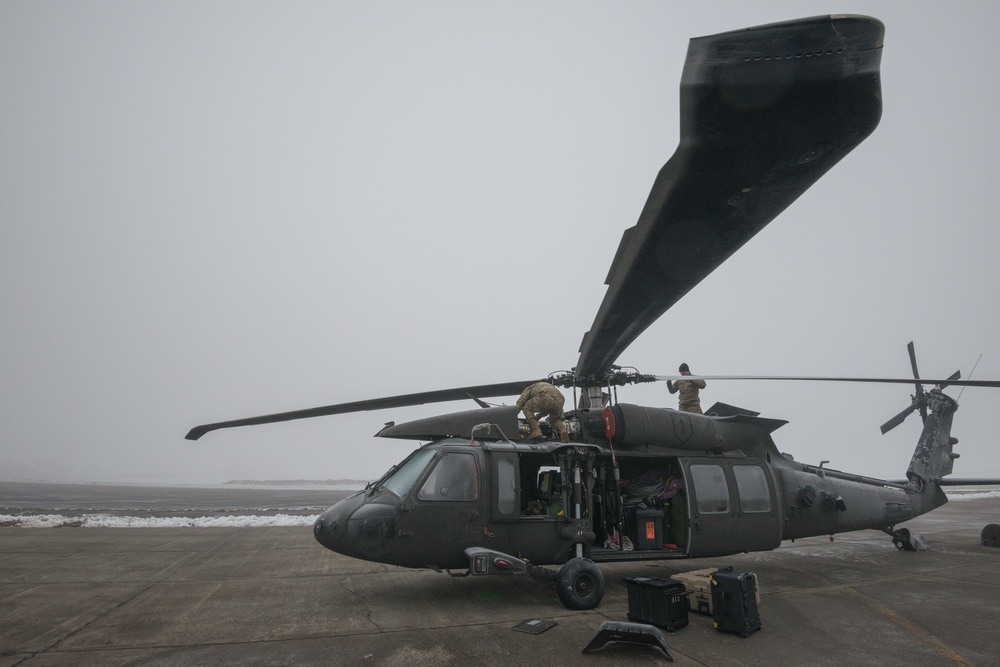 40-hour maintenance on 1CAB 1ID UH-60 Black Hawk in cold weather