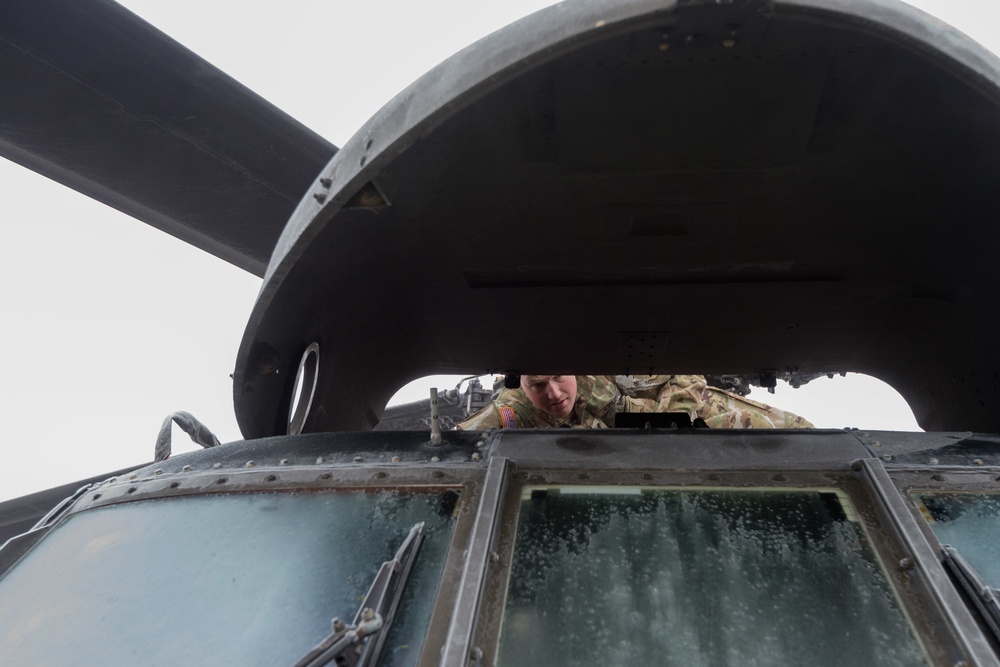 40-hour maintenance on 1CAB 1ID UH-60 Black Hawk in cold weather