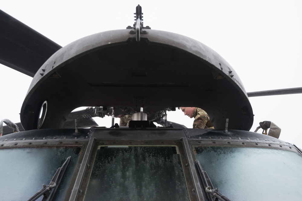 40-hour maintenance on 1CAB 1ID UH-60 Black Hawk in cold weather