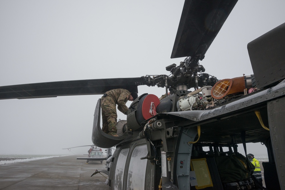 40-hour maintenance on 1CAB 1ID UH-60 Black Hawk in cold weather