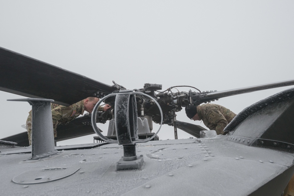 40-hour maintenance on 1CAB 1ID UH-60 Black Hawk in cold weather