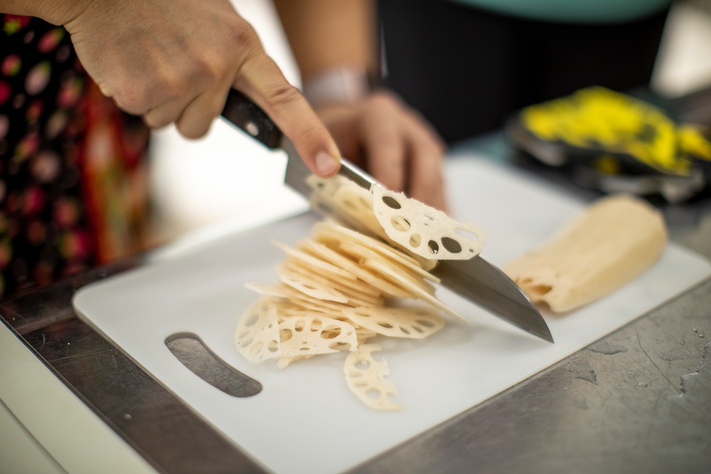 Learning the roots: station residents dig lotus roots