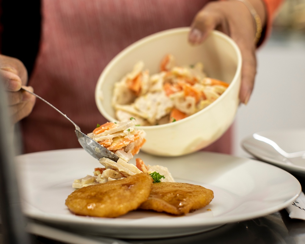 Learning the roots: station residents dig lotus roots