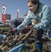 Learning the roots: station residents dig lotus roots