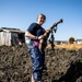 Learning the roots: station residents dig lotus roots