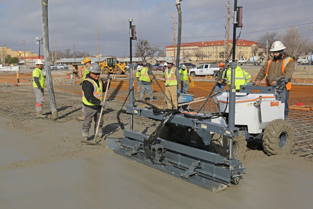 Laser-guided concrete screed machine