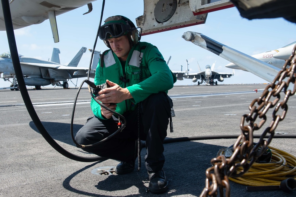 U.S. Sailor tests avionic equipment